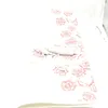 A close-up view of a white heated blanket with a pink rose pattern. Produktbild-Vorschau