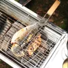 A fish is being grilled on a barbecue. Náhled obrázku produktu
