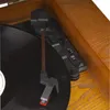 A close-up view of a record player's tonearm and vinyl record. Náhled obrázku produktu