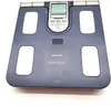 A blue Omron Karada Scan body composition scale is shown from a top-down perspective on a white background. Podgląd zdjęcia produktu