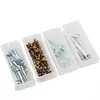 Four clear plastic storage containers filled with various hardware items like screws, bolts, anchors, and Allen wrenches. Produktbild-Vorschau