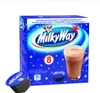 A box of Milky Way hot chocolate capsules with a mug of hot chocolate and some capsules in the foreground. Voir les images du produit