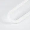 A close-up of a white hairpin leg on a white background. Produktbild-Vorschau