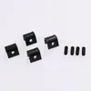 Four black metal brackets and four black screws are laid out on a white background. Produktbild-Vorschau