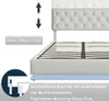 A close-up view of a white upholstered bed frame, showing the adjustable headboard and slatted base. Produktbild-Vorschau