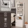 A nightstand with a charging station next to a bed. Produktbild-Vorschau
