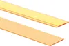Two strips of material, one gold and one orange, are shown diagonally against a white background. Podgląd zdjęcia produktu