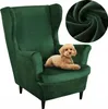A green velvet wingback chair with a small tan dog lying on the seat. A close-up of the green velvet fabric is shown in a circle in the top right corner. Anteprima dell’immagine prodotto