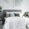 A bedroom scene with a neatly made bed. Produktbild-Vorschau