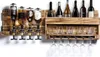 A rustic wooden wall-mounted bar unit with multiple bottle dispensers and glass holders, displaying various bottles and glasses. Anteprima dell’immagine prodotto