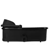 A side view of a black baby bassinet. Produktbild-Vorschau