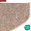 Close-up of a beige carpet stair mat with a rounded edge. Produktbild-Vorschau