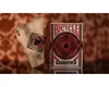 A vintage Bicycle playing card and its box are displayed on a reflective surface with a textured brown background. Produktbild-Vorschau