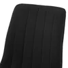 A close-up view of the black fabric back of a chair with vertical channel tufting. Produktbild-Vorschau