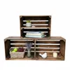 Three wooden crates are arranged to form shelves, with decorative items and folded linens placed on them. Anteprima dell’immagine prodotto