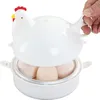 A person's hand is holding the lid of a chicken-shaped egg cooker that contains several eggs. Produktbild-Vorschau