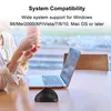 A person holding a cup next to a laptop and a vertical mouse on a wooden table. Produktbild-Vorschau