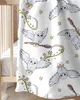 A close-up view of a white blanket with a repeating pattern of cartoon-style owls and stars. Produktbild-Vorschau