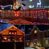 A collage of three images showing Christmas lights decorating houses and a fence. Produktbild-Vorschau