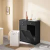 A black bathroom cabinet with a laundry basket in front of it. Podgląd zdjęcia produktu