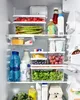 An organized refrigerator interior with various food items and containers. Náhled obrázku produktu