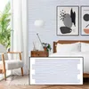 A bedroom scene with a bed, nightstand, chair, and window, showcasing the wall panels. Produktbild-Vorschau