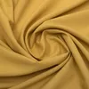 A close-up, swirled view of yellow fabric. Náhled obrázku produktu