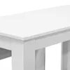 A close-up view of a white table with a thick top and block legs. Náhled obrázku produktu