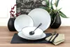 A table setting with plates, bowls, and cutlery, along with decorative elements like a vase with berries and greenery, set against a chalkboard-style background. Produktbild-Vorschau