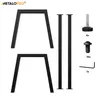 An unassembled set of black metal table legs with hardware, laid out against a white background. Produktbild-Vorschau