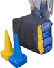A person is holding a large black bag filled with yellow and blue items, possibly traffic cones, with some blue and yellow cones stacked in the foreground. Náhľad obrázku produktu