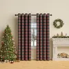 A Christmas-themed living room with a decorated tree, plaid curtains, and a fireplace. Produktbild-Vorschau