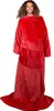 A woman wearing a red blanket with sleeves. Náhľad obrázku produktu