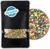 A black pouch of colorful sprinkles with a circular label and a close-up view of the sprinkles. Produktbild-Vorschau