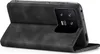 A black flip cover case for a smartphone is shown from the side, with the phone's camera module visible. Produktbild-Vorschau