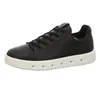 A black leather sneaker with a white sole against a white background. Produktbild-Vorschau