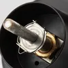 A close-up view of the internal mechanism of a fishing reel, showing a metal rod and a brass nut. Produktbild-Vorschau