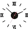 A black wall clock with Roman numerals on a white background. Náhľad obrázku produktu