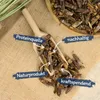 A wooden scoop filled with dried grasshoppers, placed on a burlap cloth. Text overlays highlight product features. Produktbild-Vorschau
