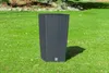 A dark gray, textured, rectangular planter sits on a green lawn. Anteprima dell’immagine prodotto