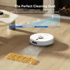 A white robot vacuum cleaner is shown on a wooden floor, with a graphic overlay illustrating suction power and text promoting its features. The word "GOOOR" is spelled out in yellow shapes on the floor in front of the vacuum. Produktbild-Vorschau