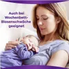 A mother holds her sleeping baby. Podgląd zdjęcia produktu
