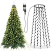 A Christmas tree decorated with lights and a separate string of lights with a plug. Produktbild-Vorschau