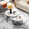 A living room setting with a sofa, coffee table, and ottoman. Produktbild-Vorschau