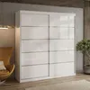 A modern bedroom or living room setting with a large white sliding door wardrobe. Produktbild-Vorschau