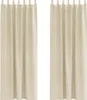 Two cream-colored velvet curtains are shown hanging against a white background.