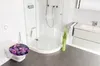 A modern bathroom with a toilet, shower, and vanity. Náhľad obrázku produktu