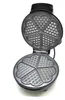 An open waffle maker with heart-shaped molds. Produktbild-Vorschau