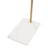 A white marble-effect rectangular base with a wooden pole extending upwards from its center, set against a white background. Náhled obrázku produktu