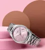 A pink Citizen watch is displayed on pink platforms against a pink and brown background. Produktbild-Vorschau